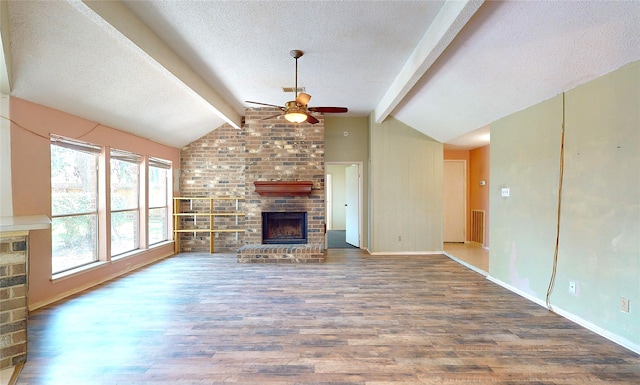 1116 N Bristol Ct, League City, TX 77573 - unfurnished living room with a textured ceiling, a fireplace, wood finished floors, and a ceiling fan
