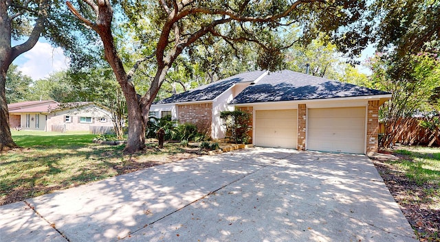 1116 N Bristol Ct, League City, TX 77573 - ranch-style house with brick siding, driveway, a shingled roof, and an attached garage