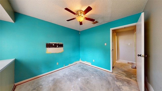 1116 N Bristol Ct, League City, TX 77573 - unfurnished room with a ceiling fan, concrete floors, and a textured ceiling