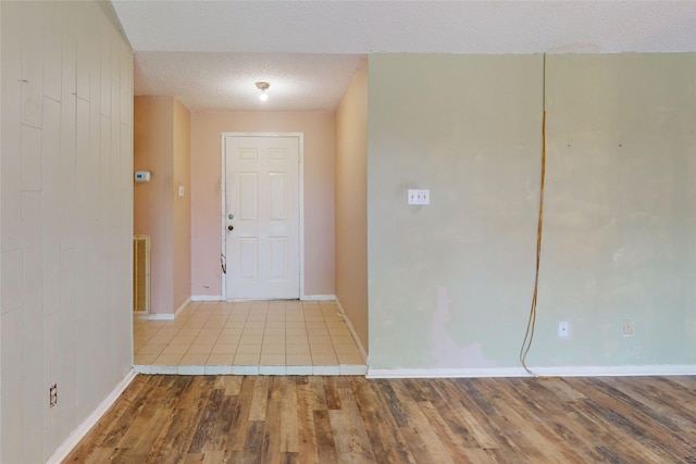 1116 N Bristol Ct, League City, TX 77573 - entryway featuring wood finished floors and a textured ceiling