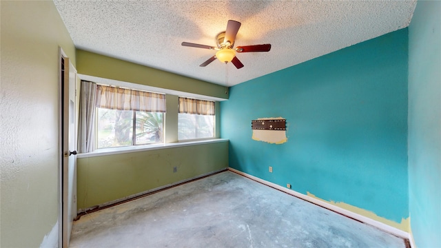 1116 N Bristol Ct, League City, TX 77573 - spare room featuring a ceiling fan, a textured ceiling, and unfinished concrete flooring
