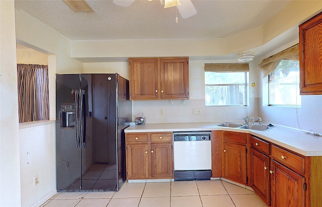 1116 N Bristol Ct, League City, TX 77573 - kitchen featuring dishwasher, black refrigerator with ice dispenser, brown cabinets, and light countertops