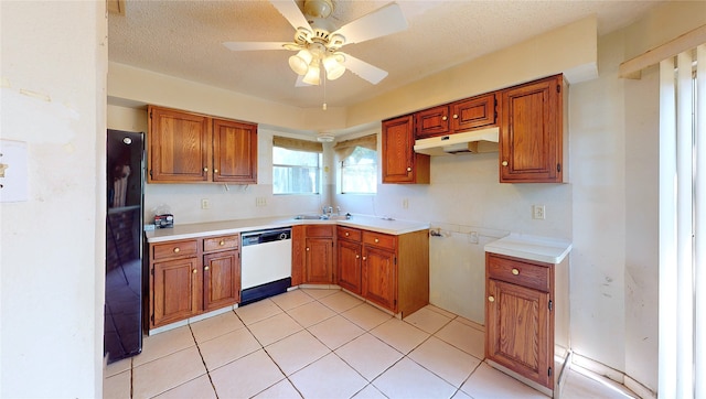 1116 N Bristol Ct, League City, TX 77573 - kitchen featuring dishwasher, under cabinet range hood, brown cabinetry, and ceiling fan