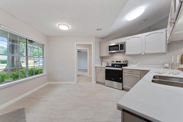4519 Pineville Ln, Spring, TX 77388 - kitchen with appliances with stainless steel finishes and light wood-type flooring