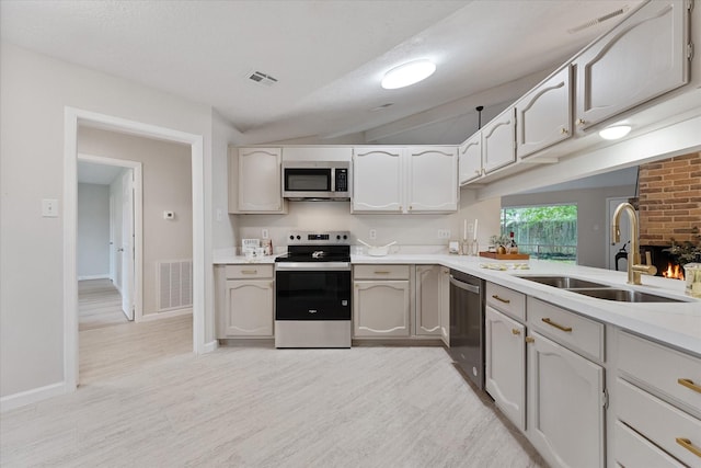 4519 Pineville Ln, Spring, TX 77388 - kitchen featuring appliances with stainless steel finishes, light wood-style flooring, and light countertops