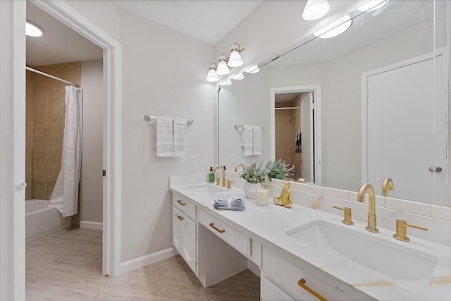 4519 Pineville Ln, Spring, TX 77388 - bathroom with double vanity, shower / bath combo, and wood finished floors