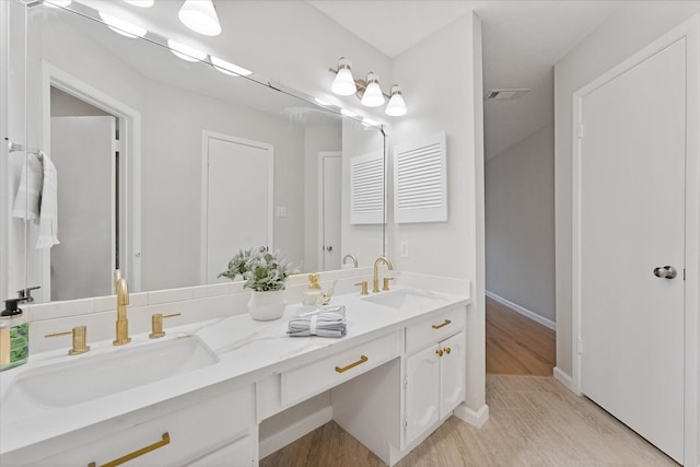 4519 Pineville Ln, Spring, TX 77388 - bathroom with double vanity and wood finished floors