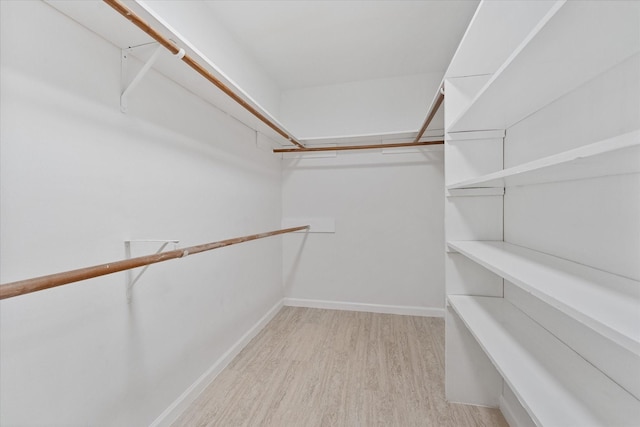 4519 Pineville Ln, Spring, TX 77388 - walk in closet featuring wood finished floors