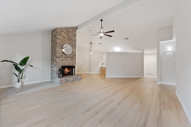 4519 Pineville Ln, Spring, TX 77388 - unfurnished living room with a ceiling fan, a brick fireplace, and wood finished floors