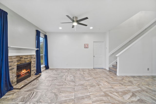 8207 Miramar Crest Ct, Tomball, TX 77375 - unfurnished living room featuring ceiling fan, stairs, a fireplace, recessed lighting, and marble finish floors