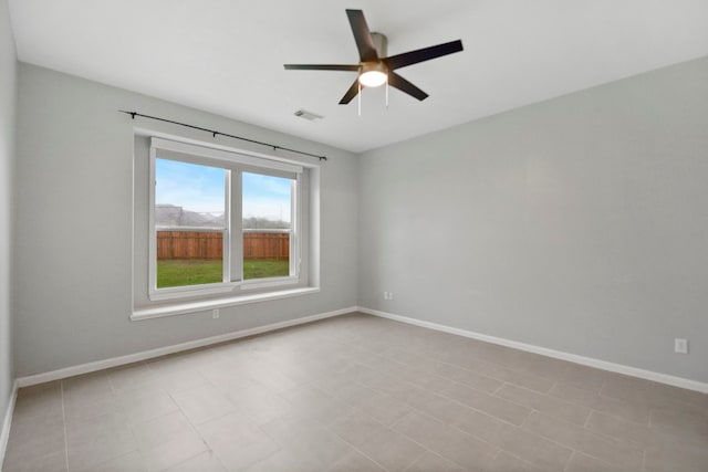 8207 Miramar Crest Ct, Tomball, TX 77375 - empty room with a ceiling fan and baseboards