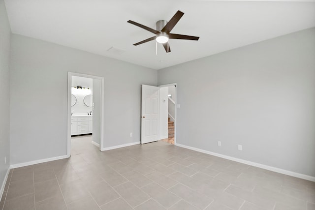 8207 Miramar Crest Ct, Tomball, TX 77375 - unfurnished bedroom with connected bathroom, a ceiling fan, and tile patterned flooring
