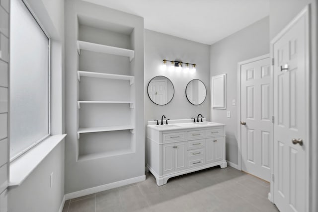 8207 Miramar Crest Ct, Tomball, TX 77375 - bathroom featuring double vanity, tile patterned floors, and a closet