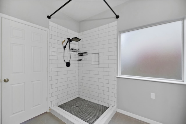 8207 Miramar Crest Ct, Tomball, TX 77375 - bathroom featuring tiled shower and tile patterned flooring