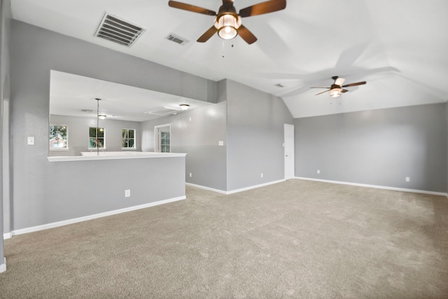 8207 Miramar Crest Ct, Tomball, TX 77375 - unfurnished living room featuring a ceiling fan, carpet, attic access, and vaulted ceiling