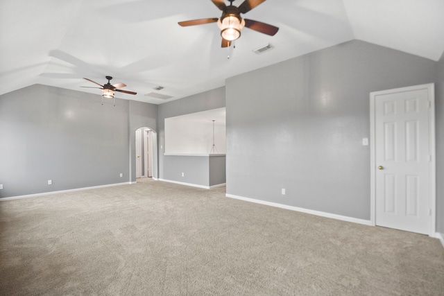 8207 Miramar Crest Ct, Tomball, TX 77375 - unfurnished living room with a ceiling fan, vaulted ceiling, carpet, and arched walkways