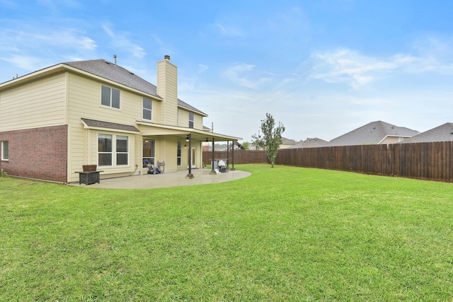 8207 Miramar Crest Ct, Tomball, TX 77375 - back of house with a chimney, a patio area, a fenced backyard, brick siding, and a shingled roof