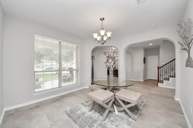 13710 Breezy Meadow Ct, Houston, TX 77044 - dining area featuring arched walkways, a chandelier, and stairway