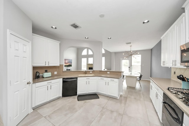 13710 Breezy Meadow Ct, Houston, TX 77044 - kitchen featuring appliances with stainless steel finishes, backsplash, white cabinets, light countertops, and light tile patterned flooring