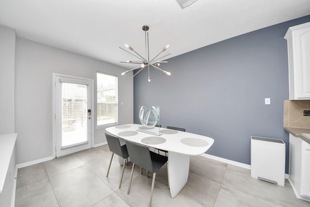 13710 Breezy Meadow Ct, Houston, TX 77044 - dining room with a chandelier and light tile patterned floors