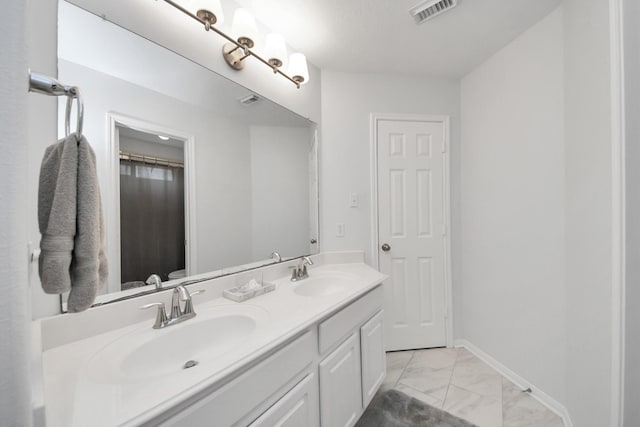 13710 Breezy Meadow Ct, Houston, TX 77044 - full bathroom with double vanity and marble finish floors