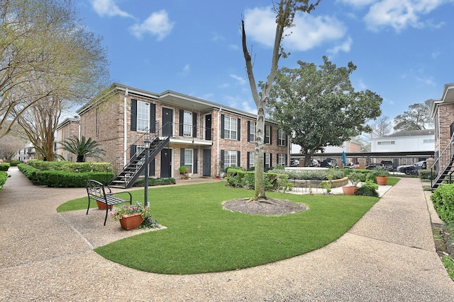 6410 Del Monte Dr Unit 93, Houston, TX 77057 - view of home's community with stairway and a lawn