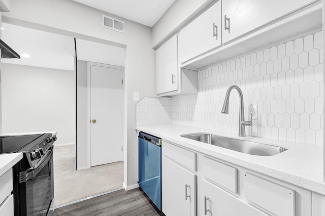 6410 Del Monte Dr Unit 93, Houston, TX 77057 - kitchen with black / electric stove, dishwashing machine, decorative backsplash, white cabinets, and dark wood-style floors