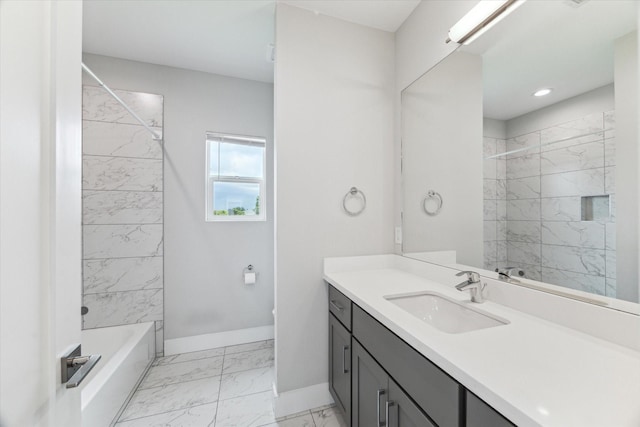 919 W 16th St Unit C, Houston, TX 77008 - bathroom with marble finish flooring, vanity, and washtub / shower combination