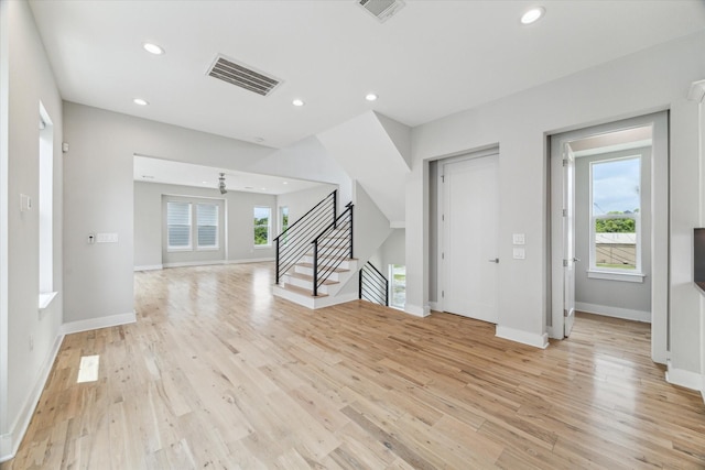 919 W 16th St Unit C, Houston, TX 77008 - unfurnished living room featuring light wood-type flooring, recessed lighting, and stairs