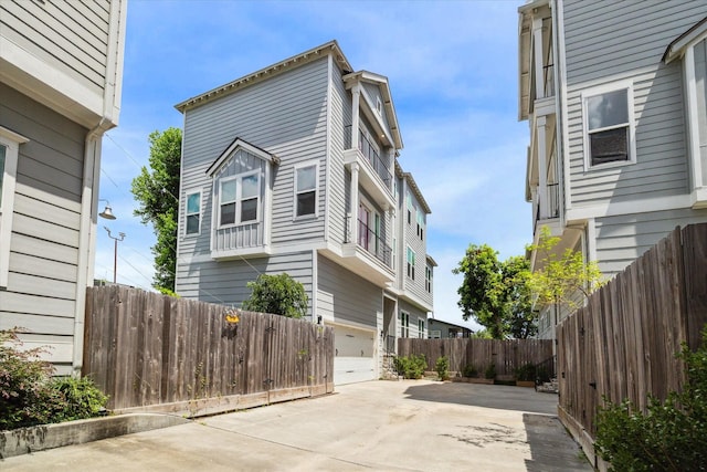 919 W 16th St Unit C, Houston, TX 77008 - view of property exterior with concrete driveway and a patio area