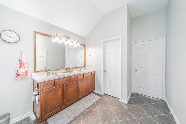 18403 Sierra Falls Ct, Tomball, TX 77377 - bathroom with double vanity, vaulted ceiling, and tile patterned flooring
