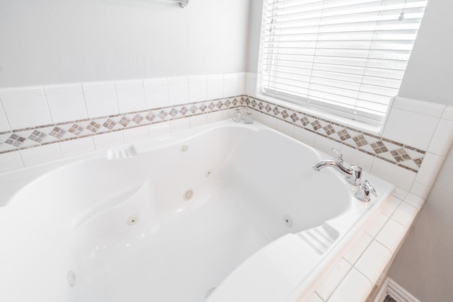 18403 Sierra Falls Ct, Tomball, TX 77377 - bathroom with a tub with jets