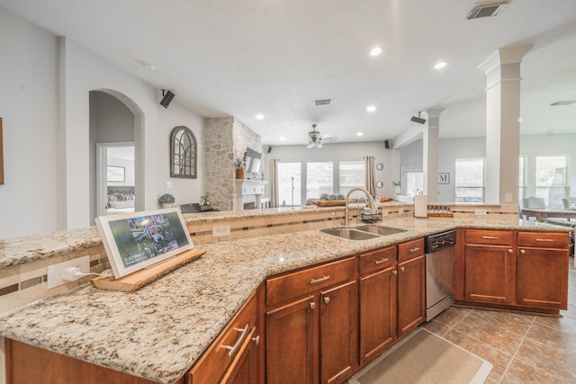 18403 Sierra Falls Ct, Tomball, TX 77377 - kitchen with dishwasher, open floor plan, ornate columns, plenty of natural light, and recessed lighting