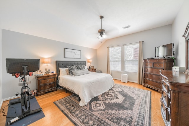 18403 Sierra Falls Ct, Tomball, TX 77377 - bedroom with vaulted ceiling, light wood-style flooring, and ceiling fan