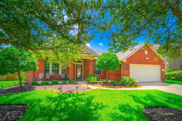 18403 Sierra Falls Ct, Tomball, TX 77377 - view of front of home featuring driveway, a garage, a front lawn, and brick siding
