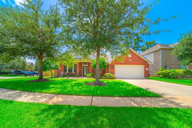 18403 Sierra Falls Ct, Tomball, TX 77377 - view of front of property featuring a garage, brick siding, a front yard, and driveway