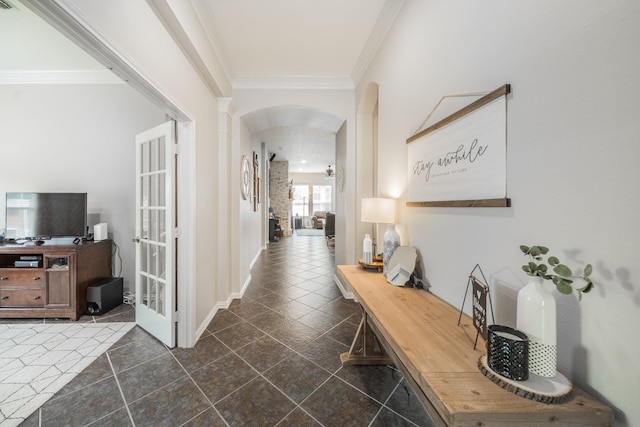 18403 Sierra Falls Ct, Tomball, TX 77377 - hallway with arched walkways, ornamental molding, and dark tile patterned flooring