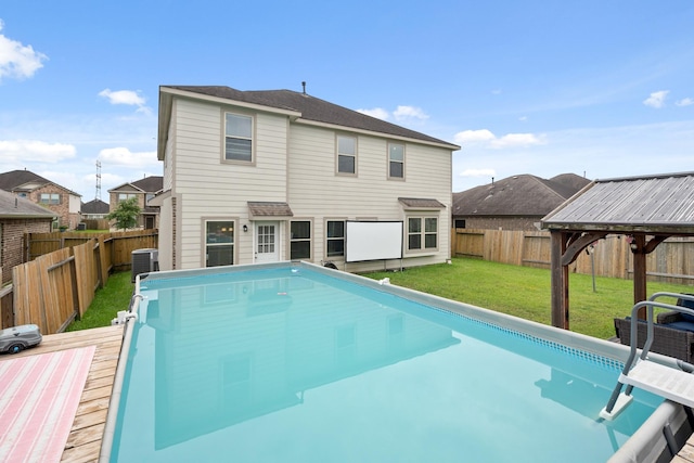 4738 Alluvial Cir, Alvin, TX 77511 - rear view of property featuring a deck, a fenced backyard, and a gazebo