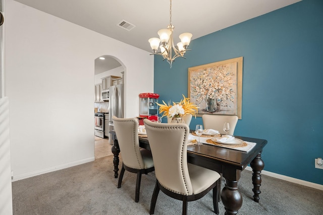 4738 Alluvial Cir, Alvin, TX 77511 - carpeted dining room with arched walkways and a chandelier