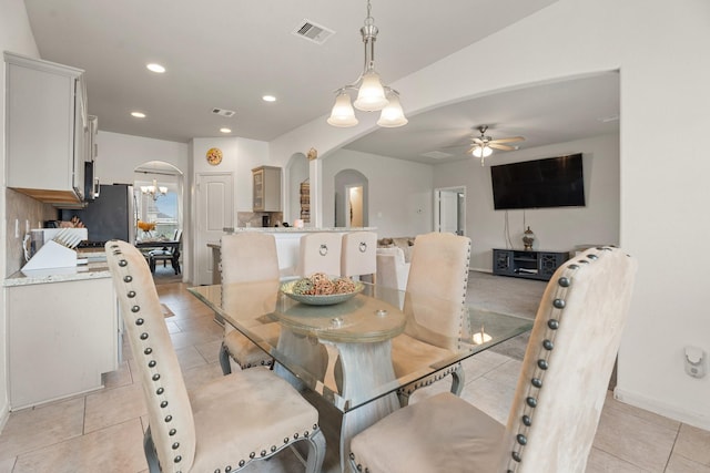 4738 Alluvial Cir, Alvin, TX 77511 - dining space with arched walkways, ceiling fan, recessed lighting, a chandelier, and light tile patterned flooring