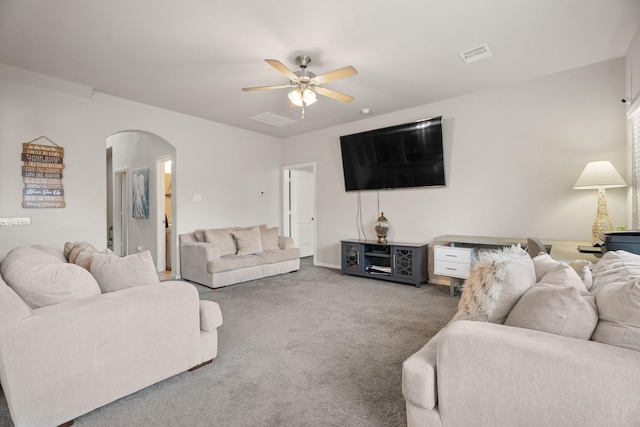 4738 Alluvial Cir, Alvin, TX 77511 - carpeted living area featuring arched walkways and ceiling fan