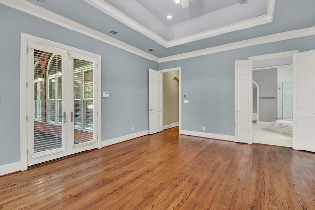 13714 Gainesway Dr, Cypress, TX 77429 - unfurnished bedroom with access to exterior, wood finished floors, a raised ceiling, ornamental molding, and ensuite bathroom