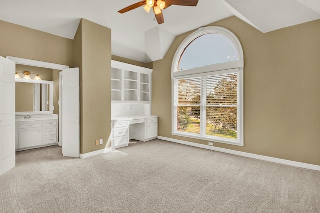 13714 Gainesway Dr, Cypress, TX 77429 - unfurnished bedroom featuring light carpet, lofted ceiling, ensuite bath, and ceiling fan