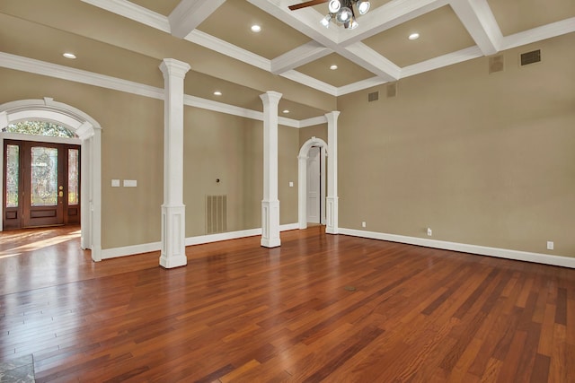 13714 Gainesway Dr, Cypress, TX 77429 - unfurnished living room featuring decorative columns, coffered ceiling, beam ceiling, wood finished floors, and recessed lighting