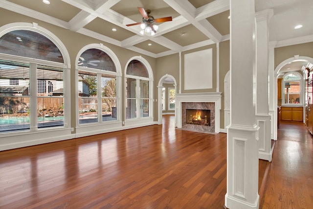 13714 Gainesway Dr, Cypress, TX 77429 - unfurnished living room featuring ceiling fan, a high end fireplace, coffered ceiling, beamed ceiling, and wood finished floors