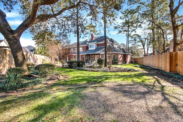 13714 Gainesway Dr, Cypress, TX 77429 - back of property with a chimney and a fenced backyard