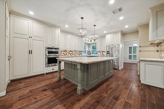 13307 Oddom Ct, Cypress, TX 77429 - kitchen with stainless steel appliances, a center island, a chandelier, gray cabinets, and dark wood-type flooring