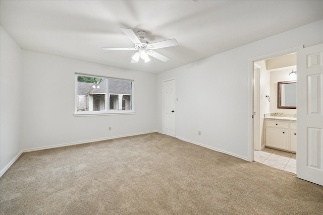 13307 Oddom Ct, Cypress, TX 77429 - unfurnished bedroom featuring light carpet, connected bathroom, and ceiling fan