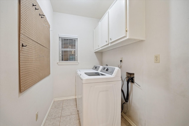 13307 Oddom Ct, Cypress, TX 77429 - laundry room featuring washing machine and clothes dryer, cabinet space, and light tile patterned flooring