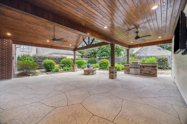 13307 Oddom Ct, Cypress, TX 77429 - fenced backyard featuring ceiling fan, exterior kitchen, and a patio area